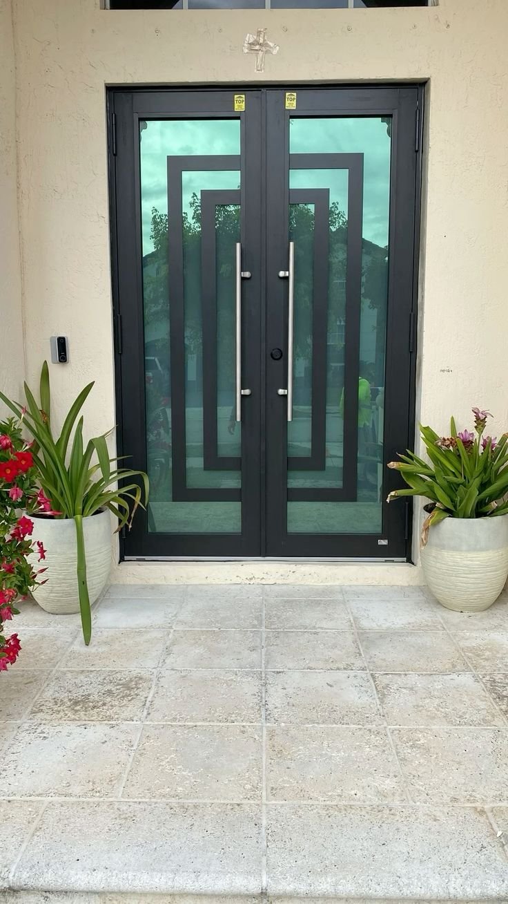 Double impact entry doors with geometric glass in Fort Lauderdale